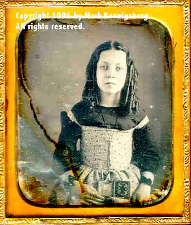 Sixth-plate daguerreotype of Cora Phillips Holding a ninth-plate daguerreotype