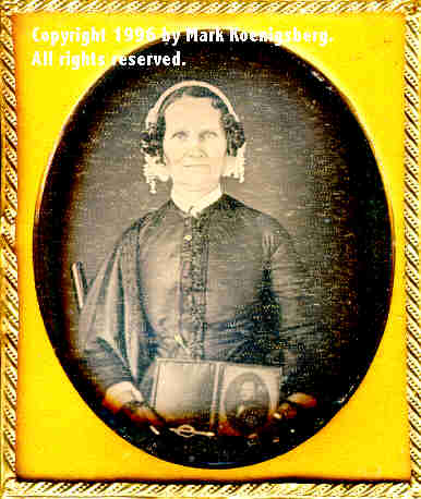 Sixth-plate daguerreotype of Woman Holding a half-plate daguerreotype