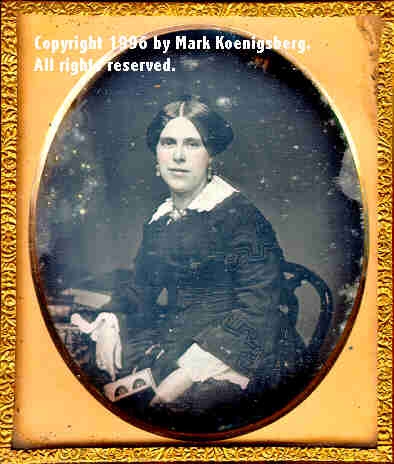 Sixth-plate daguerreotype of a Woman Holding a Mascher Stereo daguerreotype by E. Garrett of Wilmington, Delaware
