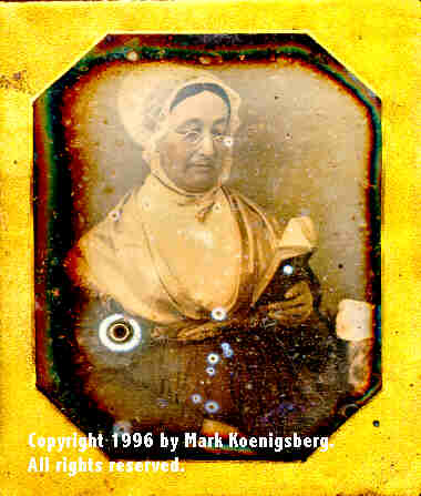 Sixth-plate daguerreotype of Woman in Bonnet Reading Book